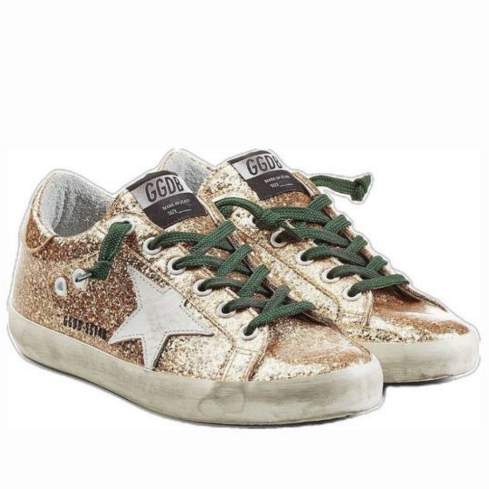 Golden Goose Superstar metallic gold glitter with a white leather star patch and dark green laces